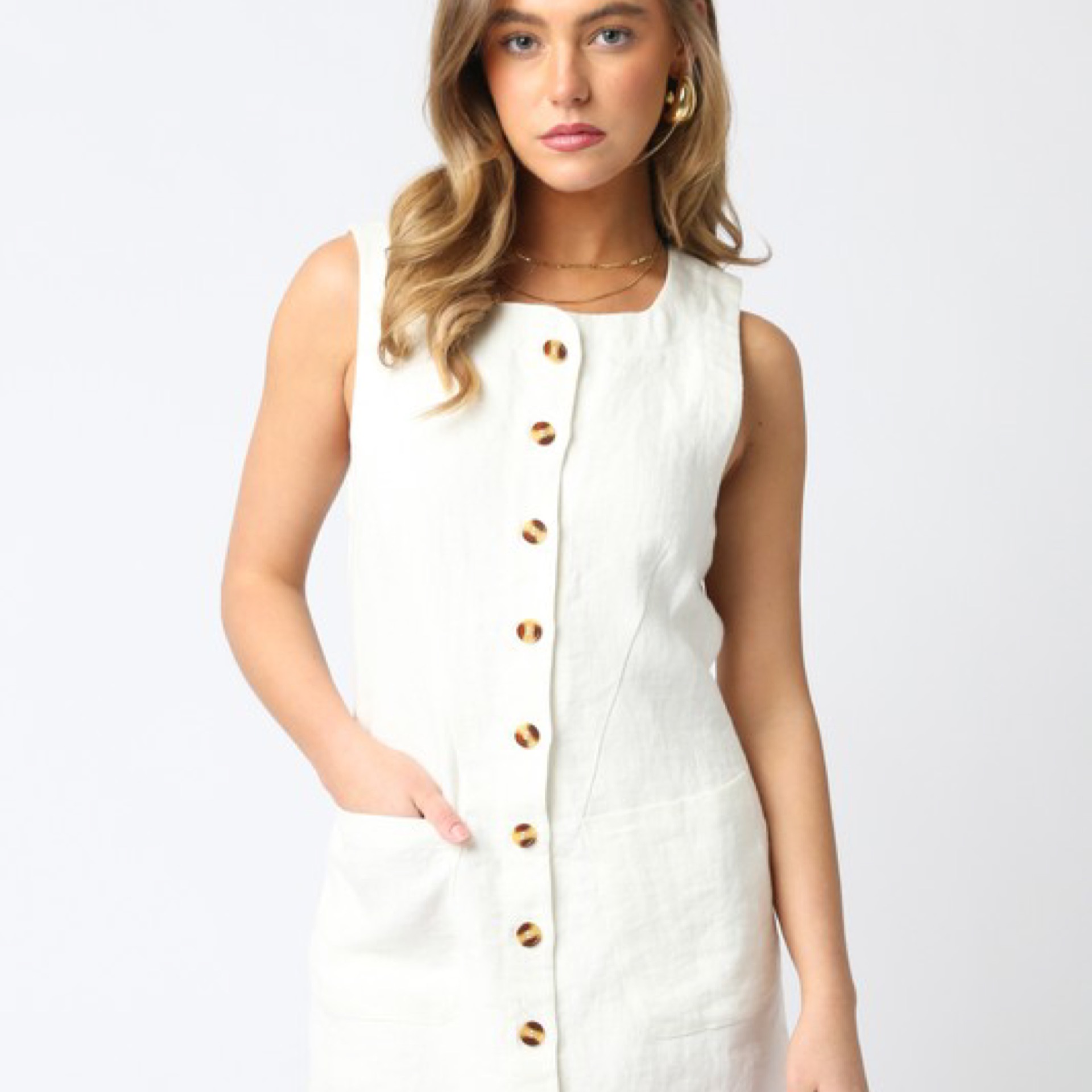 Violette Dress features a button down and an adjustable strap.
